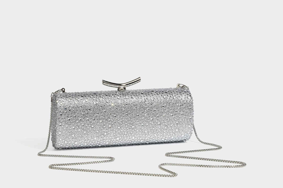 Structured rectangular hard-case clutch bag covered in all-over rhinestone crystal embellishment with curved kiss-lock top
