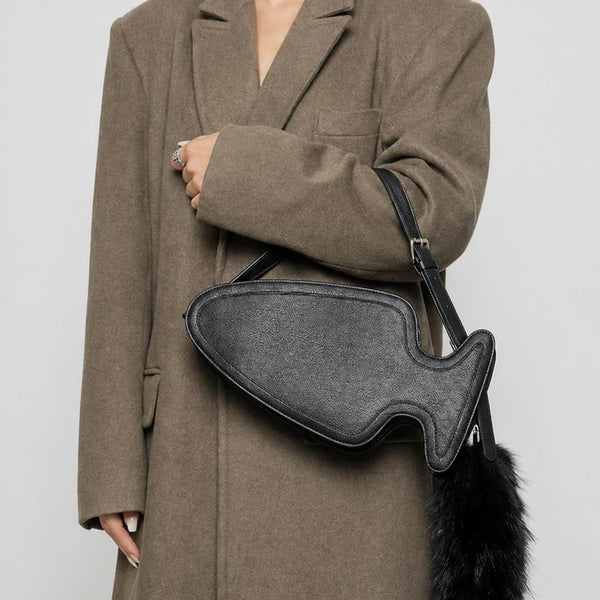 Fish-shaped pebbled leather-look crossbody bag with black faux-fur tail accent and adjustable shoulder strap, detail view 3