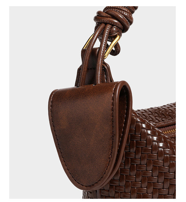 Small glossy basket-weave hobo shoulder bag in brown with knotted top handle, flap accent pocket, and gold-tone hardware