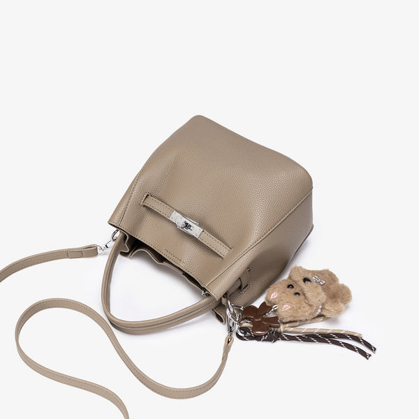 Compact structured bucket bag in pebbled leather-look finish with silver turn-lock front clasp, dual top handles, detachable
