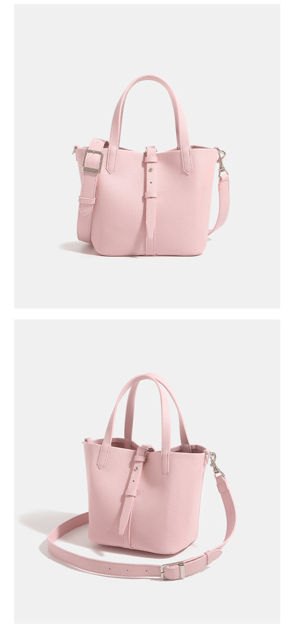 Small structured pebbled leather-look bucket tote bag with dual top handles and silver-tone hardware, detail view 13