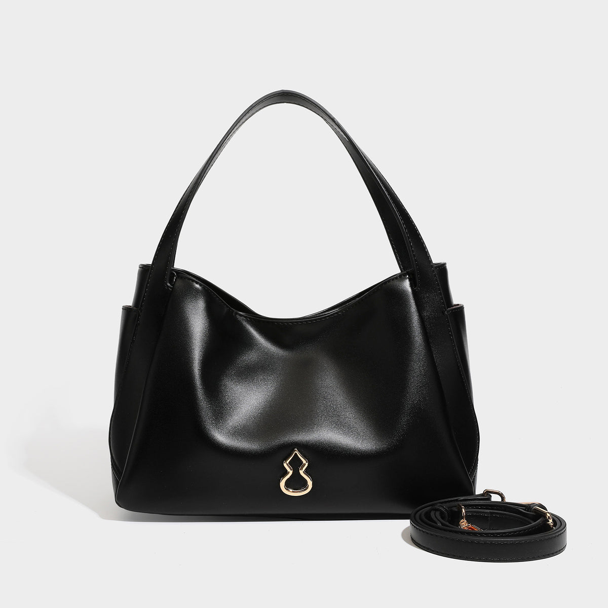 Structured glossy leather-look tote shoulder bag with dual top handles, detachable crossbody strap, side pockets, and, detail