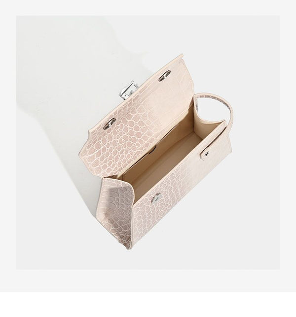 Croc-embossed mini top-handle satchel with silver turn-lock closure and adjustable crossbody strap, detail view 10