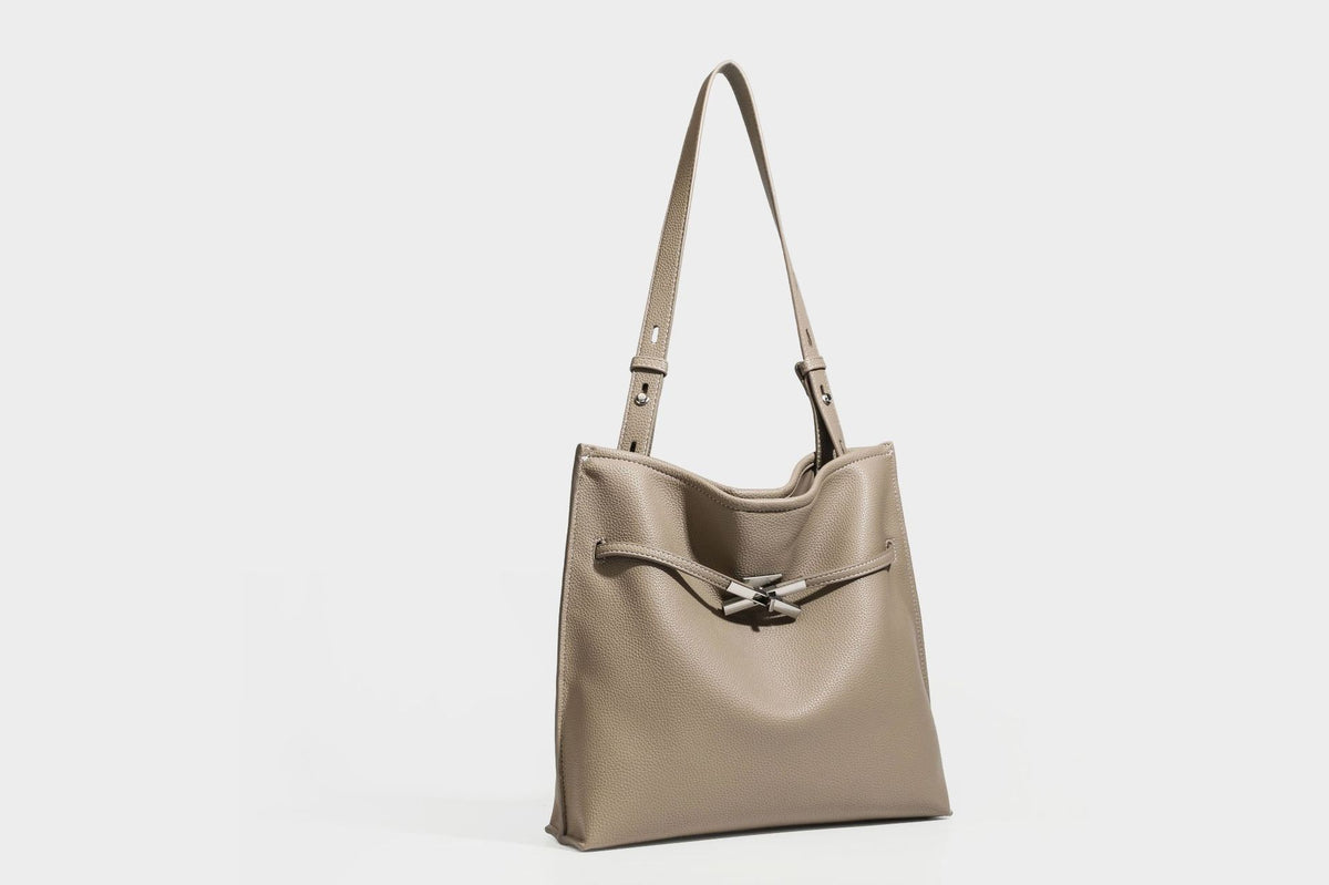 Pebbled leather-look tote bag with front toggle hardware and long shoulder strap, detail view 19