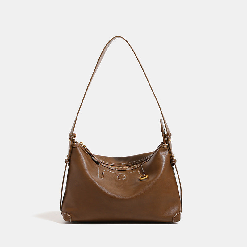 Smooth leather-look hobo bag with gold-tone ring hardware, contrast stitching, top handle and adjustable crossbody strap