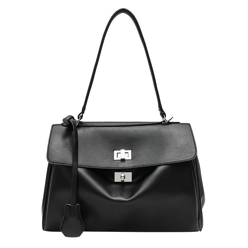 Structured black leather-look flap satchel bag with silver turn-lock hardware and top handle, detail view 5