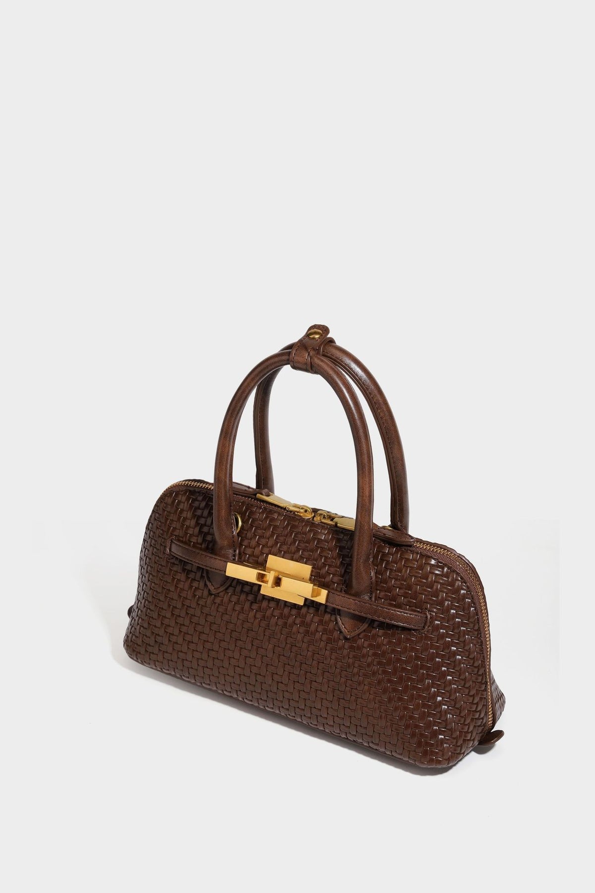Structured woven-embossed leather-look satchel with dual rolled top handles, gold-tone turn-lock closure, and detachable