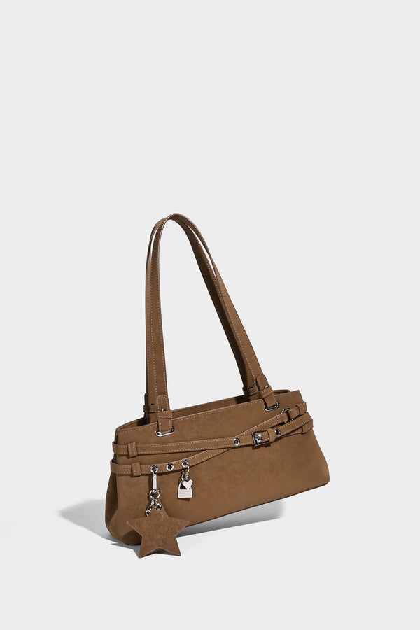 Structured trapezoid shoulder tote in dark brown matte suede-look finish with dual straps, wraparound belt bands