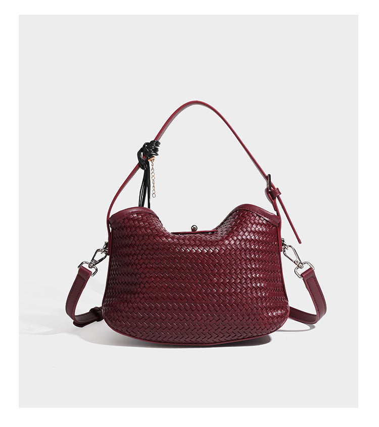 Small woven-look leather-look flap shoulder hobo bag in burgundy with silver-tone hardware and decorative tassel charm