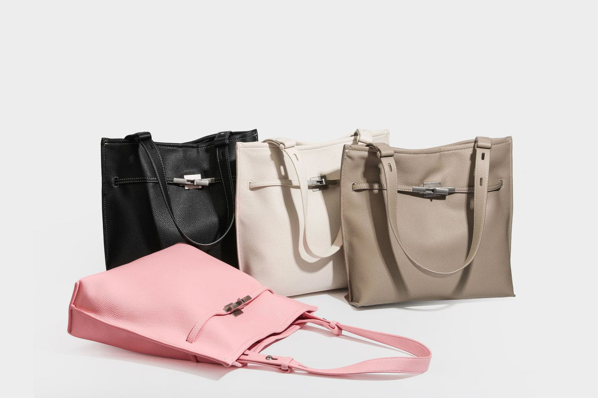 Pebbled leather-look tote bag with front toggle hardware and long shoulder strap, detail view 30