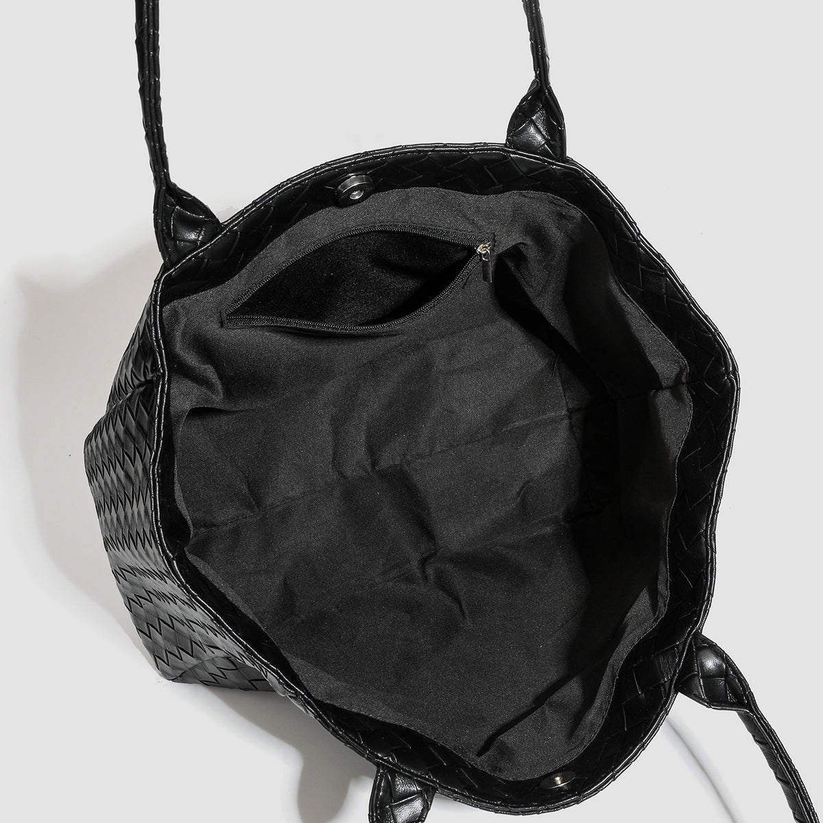 Large structured black woven diamond-pattern tote bag with braided double shoulder straps and glossy leather-look finish