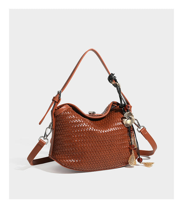 Small woven-look leather-look flap shoulder hobo bag in burgundy with silver-tone hardware and decorative tassel charm