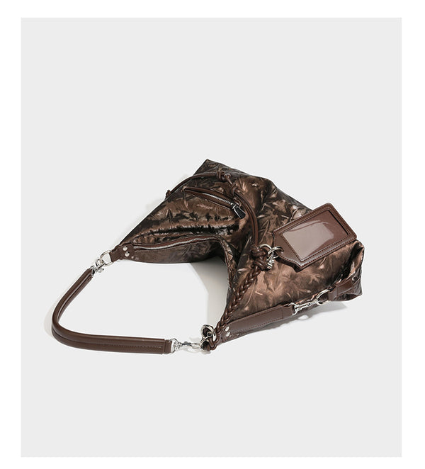 Slouchy hobo shoulder bag in crinkled metallic brown leather-look finish with braided rope knots, silver-tone hardware