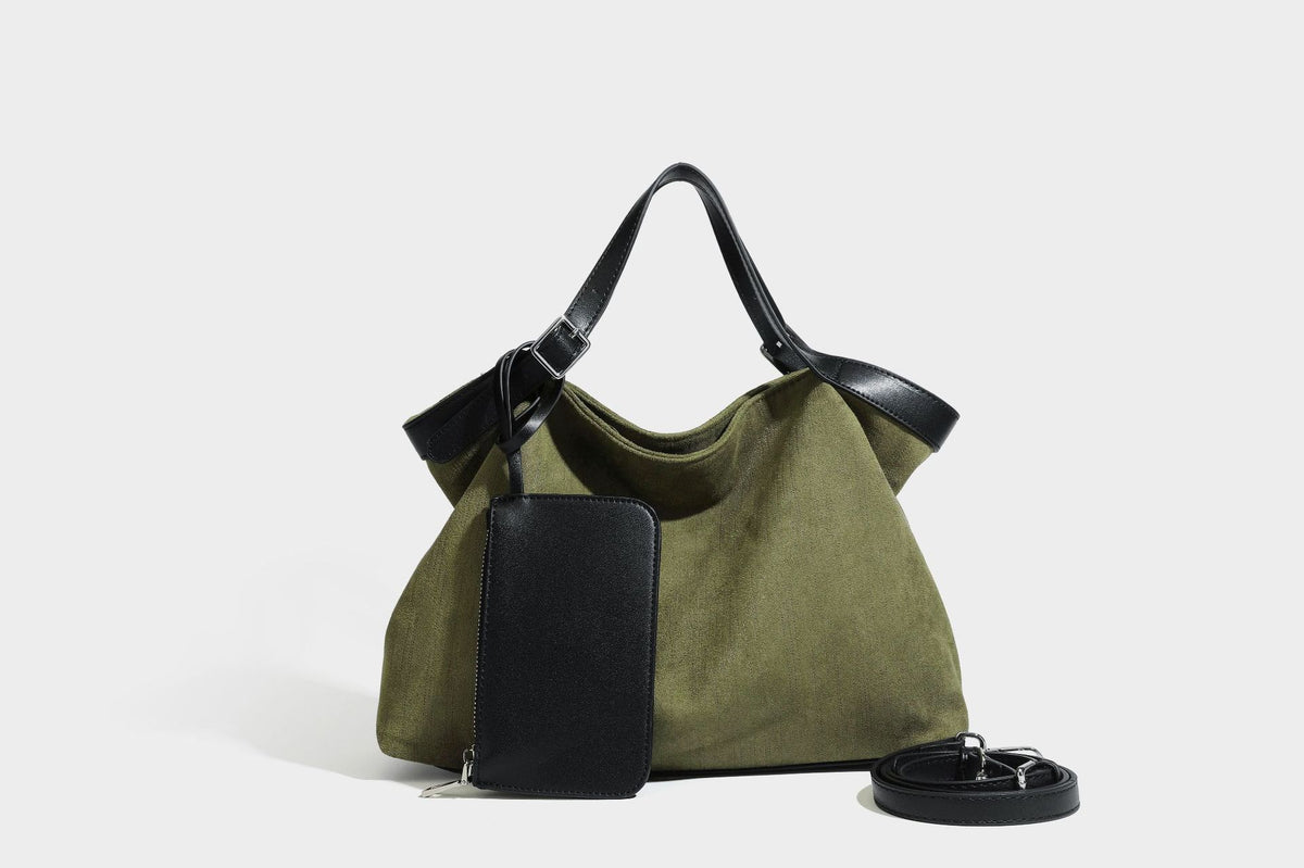 Weich fallender olivgrüner Shopper in Canvas-Optik mit Henkeln in schwarzer Lederoptik, abnehmbarem Reißverschlusstäschchen und silberfarbenen Beschlägen
