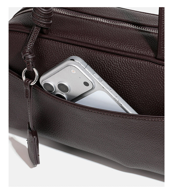 Structured rounded rectangular shoulder bag with pebbled leather-look finish, dual long handles, top zipper, front zip