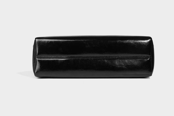Structured flap crossbody bag in dark brown and cream color-block with white contrast stitching, adjustable shoulder strap