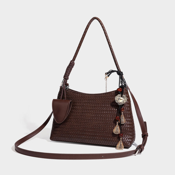Woven-texture hobo shoulder bag in brown with braided top handle, adjustable crossbody strap, front flap pocket, and, front