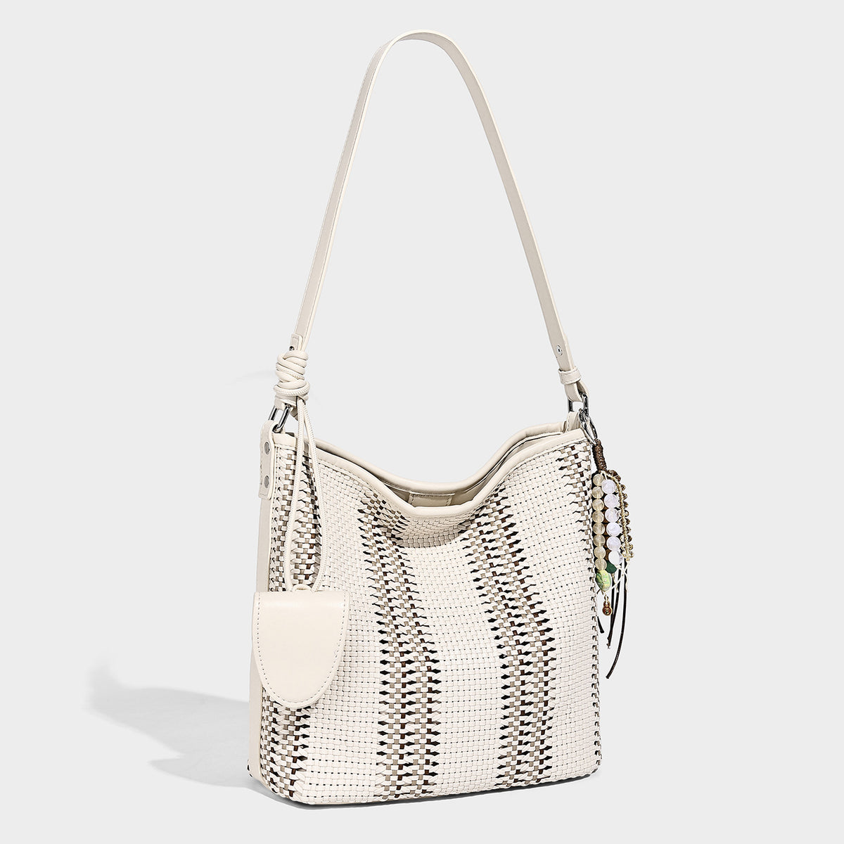 Woven bucket shoulder bag with leather-look trim, silver-tone hardware, and beaded tassel charm, detail view 12