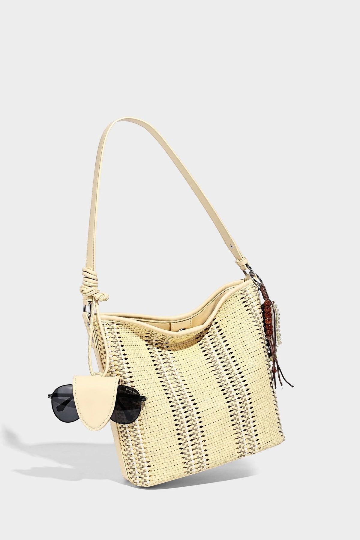 Woven bucket shoulder bag with leather-look trim, silver-tone hardware, and beaded tassel charm, detail view 25