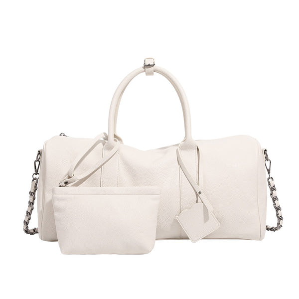 Large cream white pebbled leather-look barrel travel bag with twin top handles, chunky chain shoulder strap, front zip