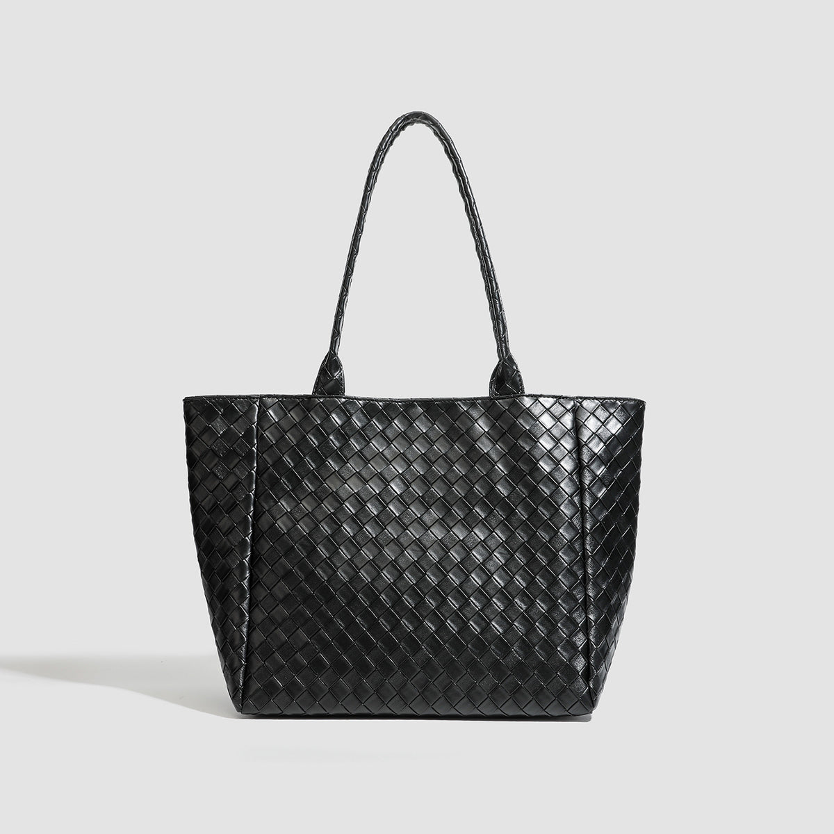 Large structured black woven diamond-pattern tote bag with braided double shoulder straps and glossy leather-look finish