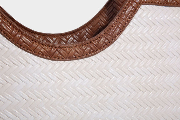 Large open-top woven tote bag with contrasting braided double handles and matching drawstring pouch, detail view 25
