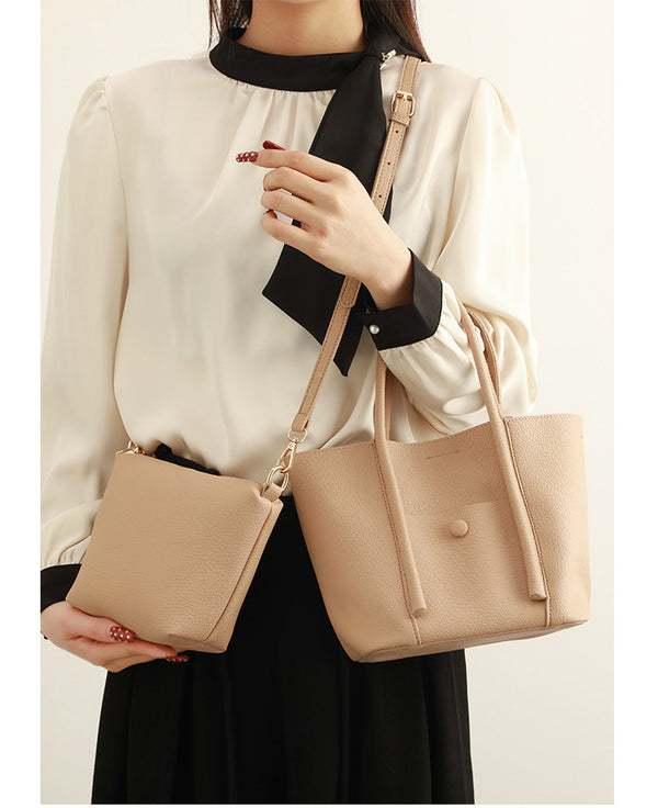 Structured pebbled matte tote bag with front snap pocket, dual top handles, and detachable zip pouch in almond beige, detail