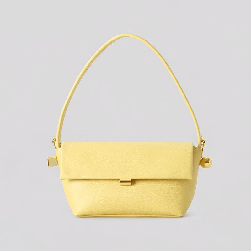 Structured trapezoid flap shoulder bag in red leather-look finish with gold-tone turn-lock clasp, sphere accent, and curved