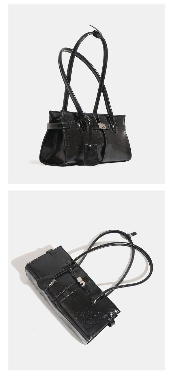 Structured glossy leather-look tote bag with long loop handles and silver turn-lock buckle closure, detail view 12