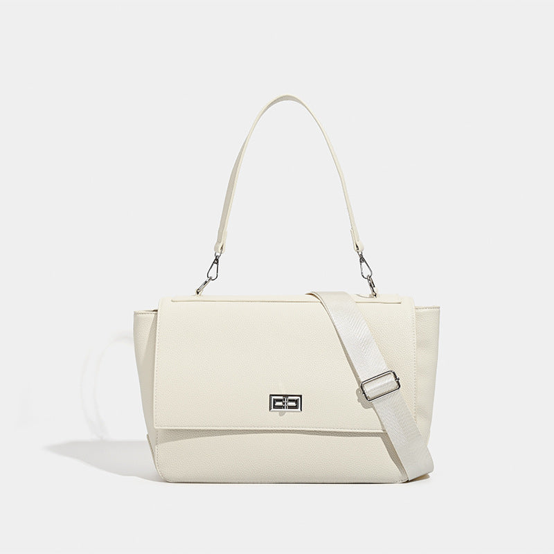 Large structured pebbled-finish flap shoulder bag with silver turn-lock closure and adjustable strap, front view