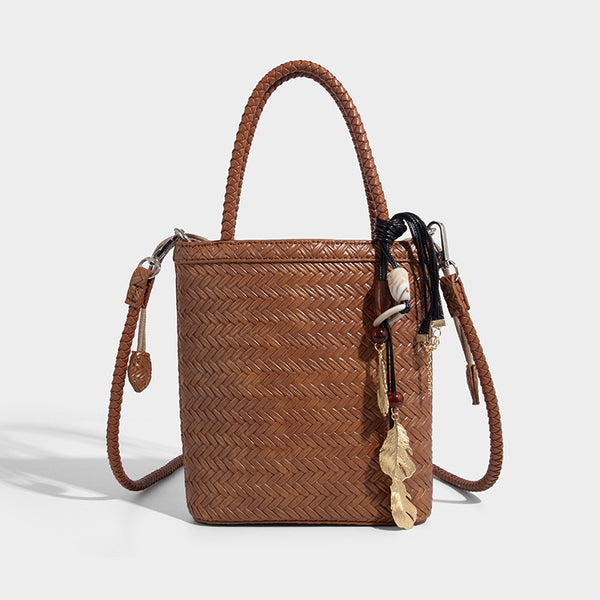 Small structured woven-texture tote bag with braided top handles and drawstring inner pouch, detail view 8