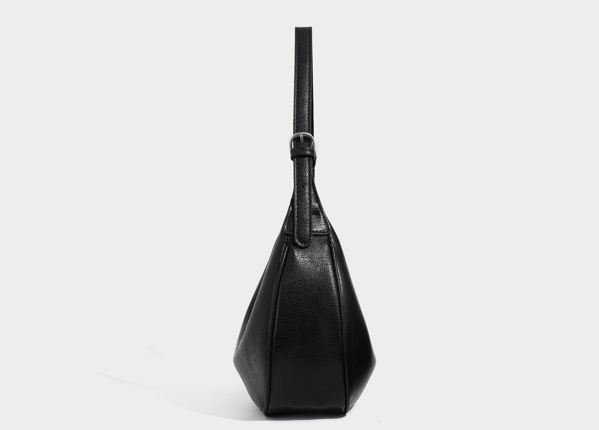Crescent half-moon shoulder bag in pebbled leather-look finish with adjustable strap and silver-tone hardware, detail view 21