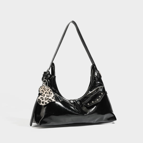 Glossy dark brown hobo shoulder bag with slim strap, front zip pocket, stud detail, and detachable leopard-print heart charm