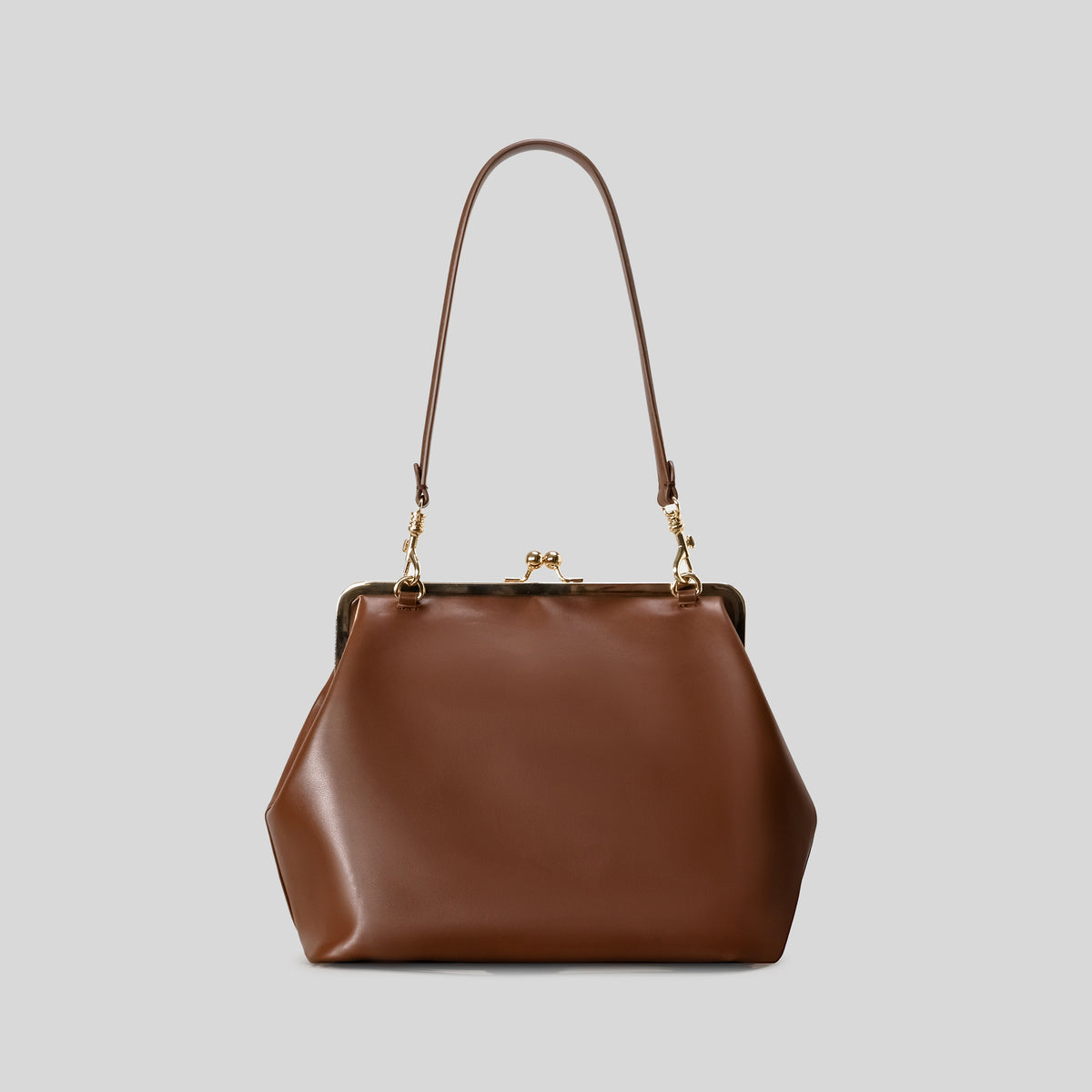 Oversized kiss-lock frame handbag with gold-tone metal clasp and smooth leather-look finish, detail view 7