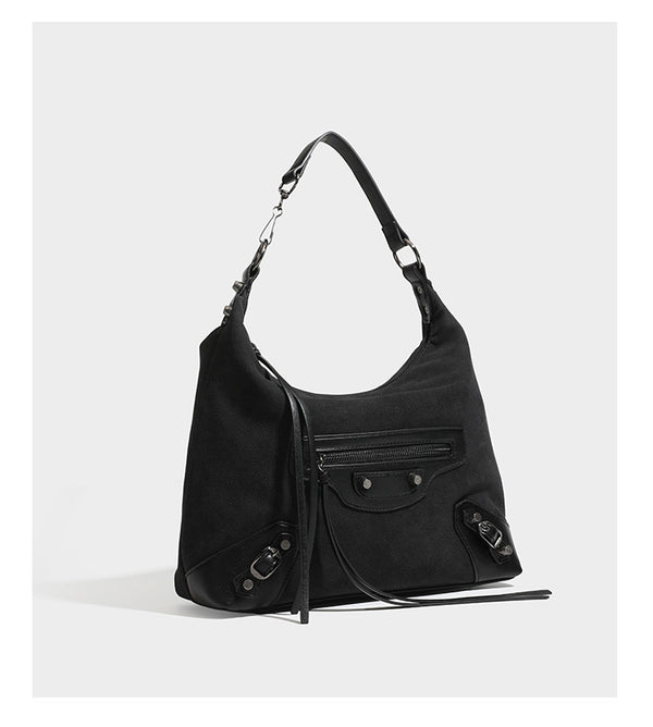 Slouchy suede-finish hobo shoulder bag with dark hardware, exterior zip pocket, tassel ties, and detachable crossbody strap