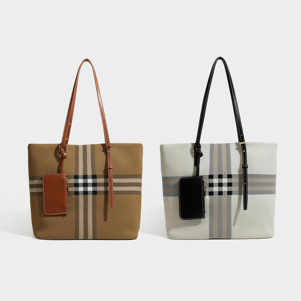 Large structured plaid check tote bag with smooth tan leather-look shoulder straps, attached front zip pouch, and gold-tone