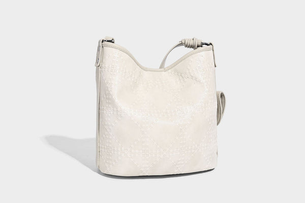 Diamond-quilted leather-look bucket shoulder bag with knotted strap accent and attached mini pouch, detail view 24