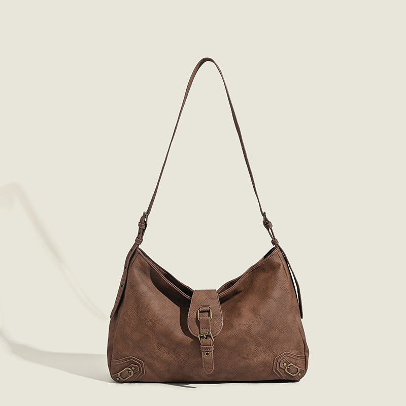 Slouchy distressed leather-look hobo bag with antique brass buckle closure and adjustable shoulder strap, detail view 8