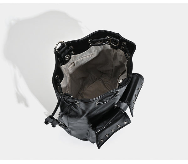 Glossy leather-look drawstring bucket bag with silver dome studs and chain shoulder strap, detail view 8