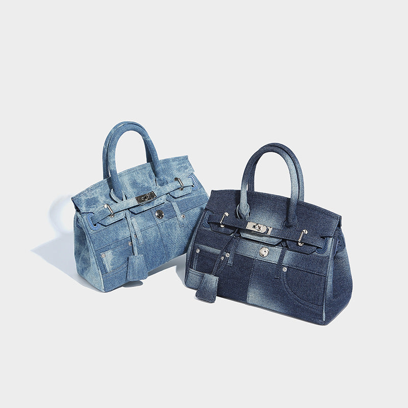 Structured washed-denim patchwork satchel with rolled top handles, flap turn-lock closure, front patch pockets, and, detail