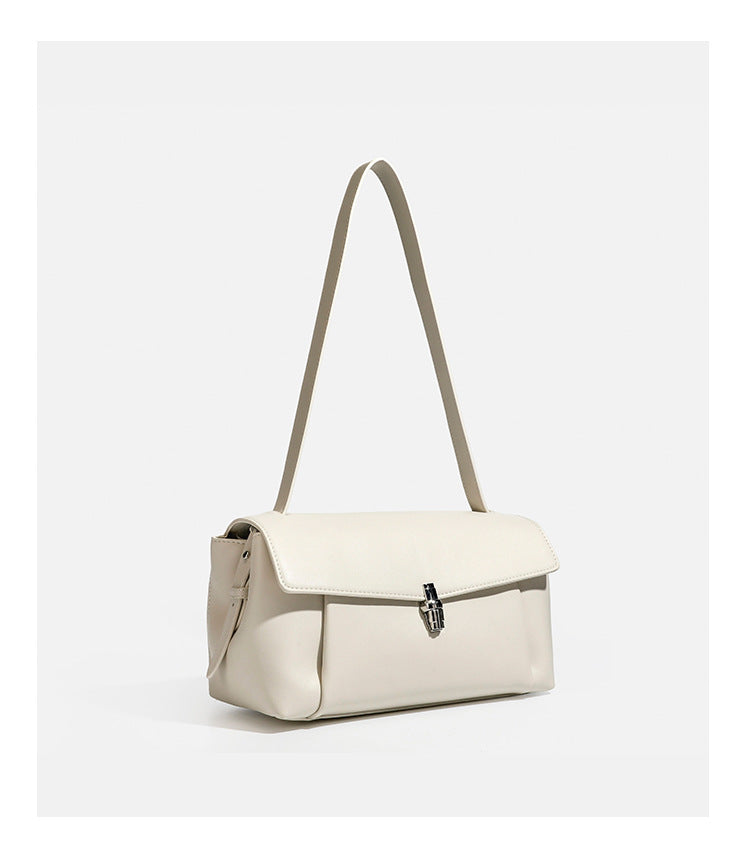 Structured rectangular flap shoulder bag with smooth leather-look finish, silver-tone turn-lock clasp, and long slim
