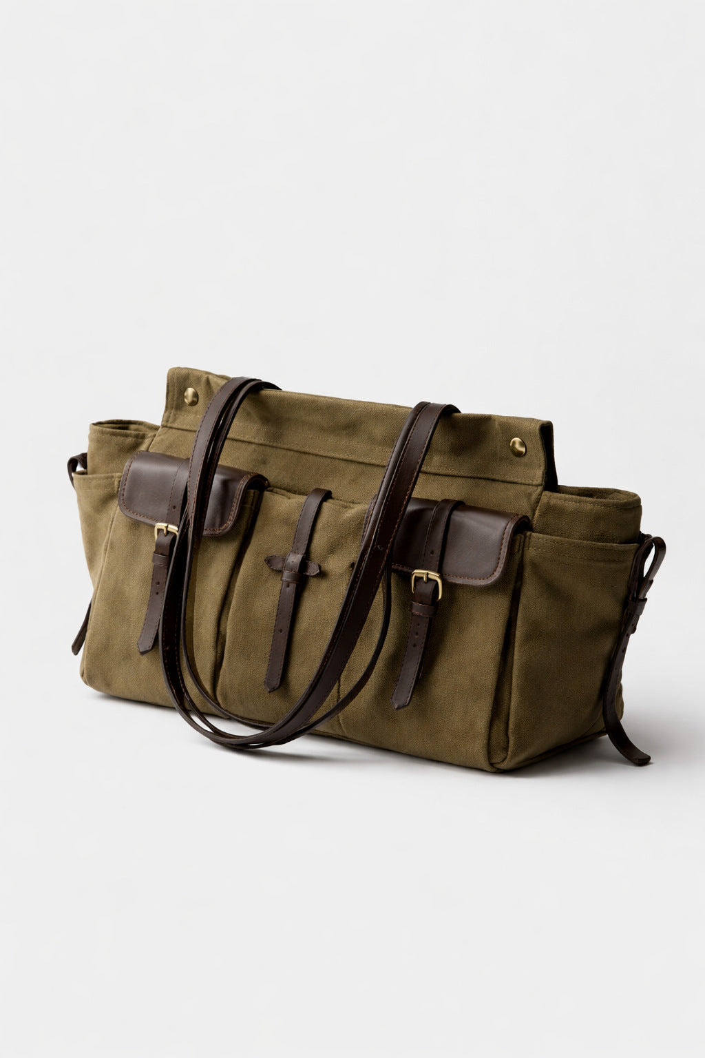 Large olive canvas shoulder tote bag with multiple front buckle-strap pockets and dark brown leather-look trim, detail view
