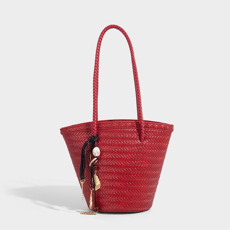 Chevron-woven bucket tote bag with braided shoulder straps and matching drawstring pouch, detail view 10
