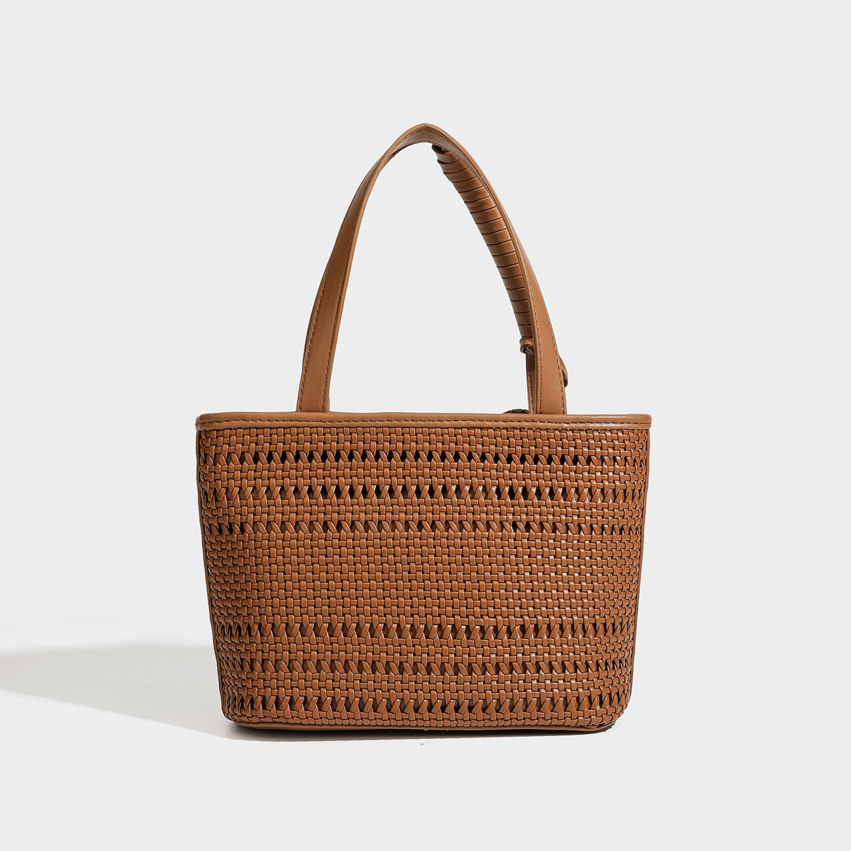 Structured open-weave tote bag with smooth leather-look trim, double top handles, detachable crossbody strap, and mini zip