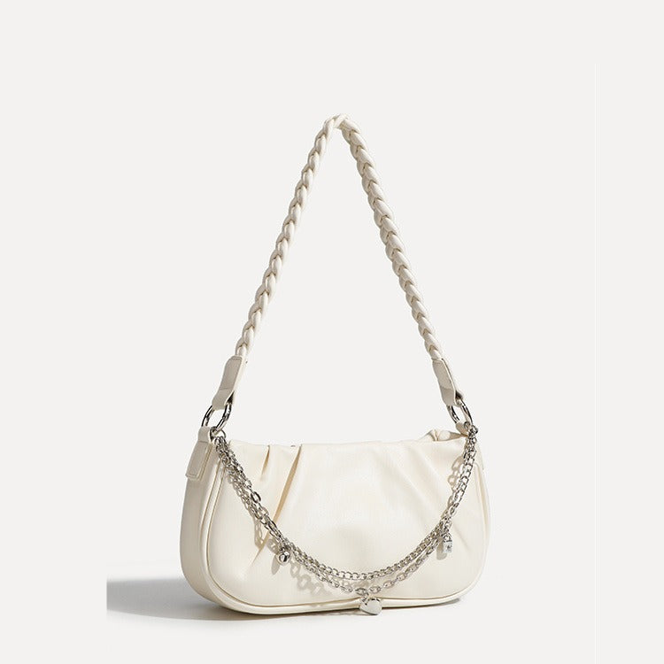Slouchy hobo shoulder bag with gathered leather-look panels, silver-tone chain with charm pendants, and braided strap, detail