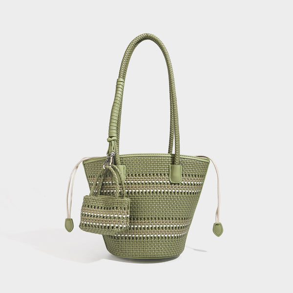 Structured woven bucket tote bag in pastel blue with braided shoulder strap, open lattice weave body, cream drawstring