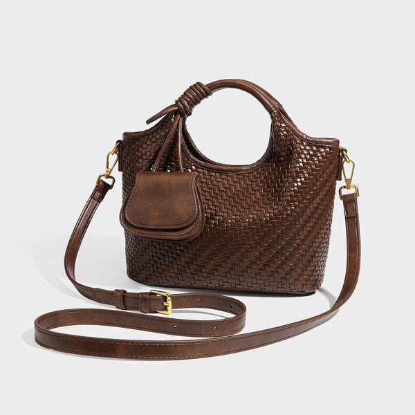 Woven leather-look tote bag in mocha brown with knotted top handle, front flap pocket, and detachable crossbody strap with