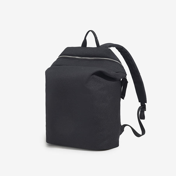 Structured matte nylon backpack with top zip closure, front zip pocket, top carry handle, and adjustable shoulder straps