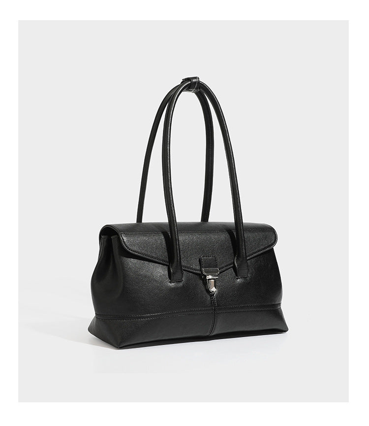 Structured rectangular satchel bag with dual rounded top handles and central metal turn-lock flap closure, detail view 14