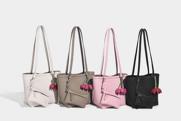 Structured pebbled leather-look tote bag in taupe with long shoulder strap, detachable zip pouch, and pink tulip flower
